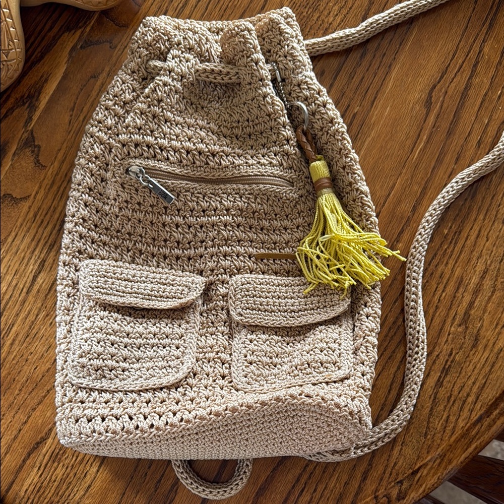 The San Tan and Yellow Crochet Backpack with Drawstring Closure